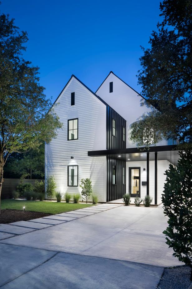 Modern Farmhouse With White Dormer Exterior And Black Accent Wall