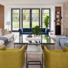 Midcentury Living Room With Blue Ottomans