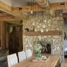 Rustic Dining Room With Edison Bulb Pendants