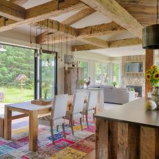 Open Plan Country Dining Room With Multicolor Rug