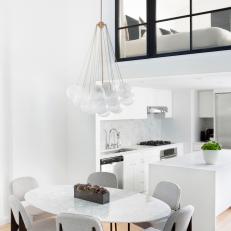 White Modern Kitchen and Dining Area 