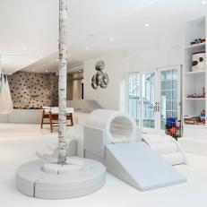 Basement Converted Into Playground With Climbing Wall