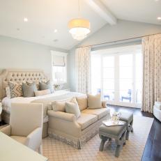 Traditional White And Neutral Master Bedroom With Upholstered Headboard And Sitting Areas