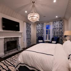 Contemporary Master Bedroom With Fireplace And Chandelier