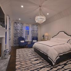 Contemporary Blue And White Master Bedroom With Upholstered Headboard And Chandelier