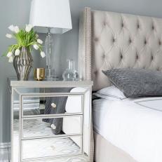 Mirrored Nightstand and Tufted Headboard