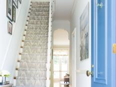 Blue Foyer With Classic White Staircase And Pendant