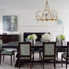 Contemporary Fine Dining Room With Seafoam Upholstered Dining Chairs And Brass Chandelier