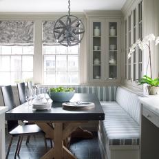 Traditional Gray Breakfast Nook Banquette With Modern Details And Lighting