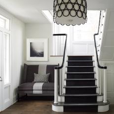 Classic Black And White Foyer With Stairs And Seating