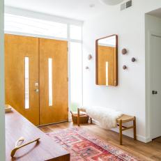 Midcentury Modern Foyer With Pink Rug