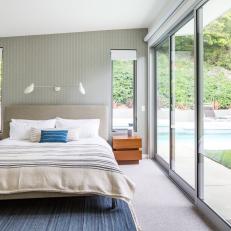 Blue Gray Contemporary Bedroom With Pool View