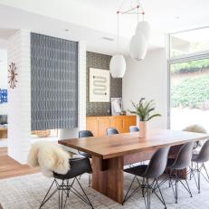 Neutral Midcentury Modern Dining Room With Sheepskins