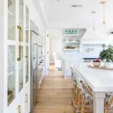 Contemporary Eat In Kitchen With White Cabinets And Work Island With Seating