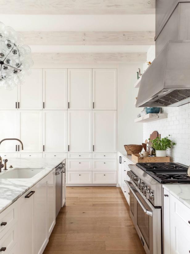 Bright Transitional Kitchen With Floor To Ceiling White Cabinets