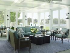transitional sunroom with blue sofa