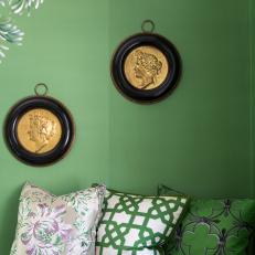 Elegant Eclectic Living Room With Accent Pillows And Antique Gold Wall Medallions