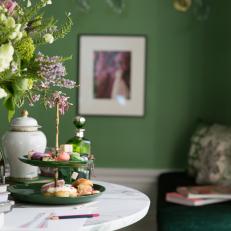 Eclectic Green Living Room Detail With Marble Table And Tea Setting