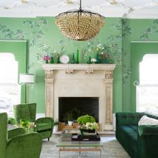Elegant Eclectic Living Room With Hand Painted Wallpaper And Green Upholstered Furnishings And Gold Accents