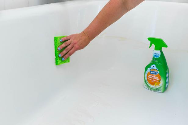 Use a sponge and Scrubbing Bubbles Bathroom Grime Fighter to clean your bathtub.