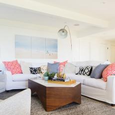 Pink, Patterned Pillows Enliven Neutral Sofa