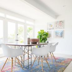 Dining Room Anchored By Pink and Blue Area Rug