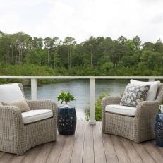Lake Cottage Deck With Modern Railing And Upholstered Seating