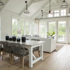 Modern White Cottage Great Room With White Furnishings And Pendant Lights