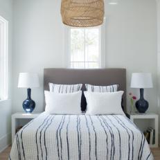 White Cottage Guest Bedroom With Upholstered Headboard And Natural Accents