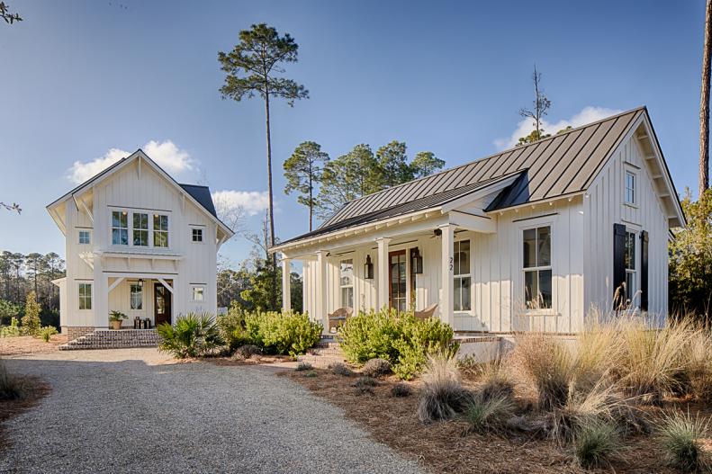 White Cottage Farmhouse And Guest Cottage With Traditional Accents