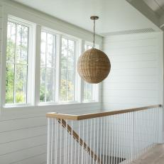Modern White Cottage Stairway With Modern Custom Handrail And Woven Pendant