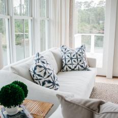 Modern White Cottage Living Room With Upholstered Sofas And Blue Accent Pillows