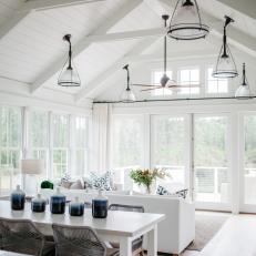 Modern White Cottage Open Concept Living And Dining Room With Vaulted Ceiling