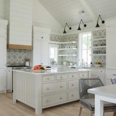 Modern White Cottage Open Concept Kitchen And Dining Room With Open Shelves And Work Island