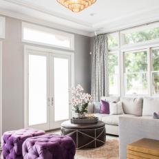 Gray Family Room With Purple Ottomans