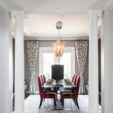 Gray Formal Dining Room With Red Chairs