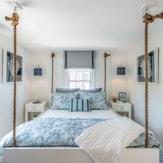 Blue and White Coastal Bedroom With Rope Bed