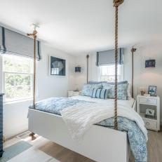 Blue and White Cottage Bedroom With Rope Bed