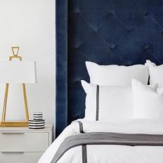 Bedroom With Blue Velvet Headboard