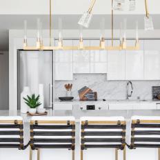 White Modern Open Plan Kitchen With Brass Lights