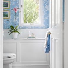 Blue and White Powder Room With Pink Orchid