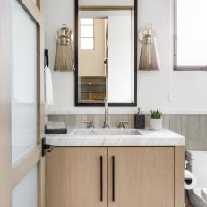 Powder Room With Gray Glass Sconces
