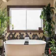 Soaking Tub Surrounded By Tall Plants