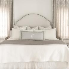 Neutral Transitional Bedroom With Monogrammed Pillow