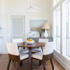 Coastal Dining Area With Two-Toned Chairs