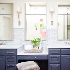 Contemporary Master Bathroom Retreat With Double Sink Vanity With Blue Cabinets And Modern Sconces