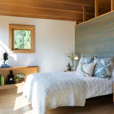 Contemporary Master Bedroom With Green Stained Wood Accent Wall And White Linens