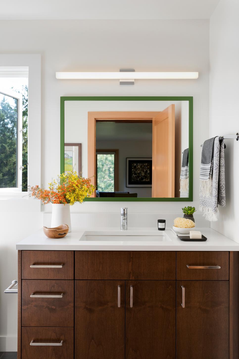 Modern White Bathroom With Single Sink Walnut Vanity And Green Framed ...
