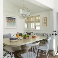 Transitional Dining Nook With Geometric Pendant
