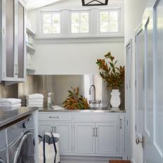 Country Laundry Room With Stainless Steel Counters